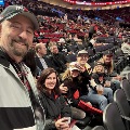 DrColladainthestandsataPortlandTrailblazersbasketballgamewithhisfamily
