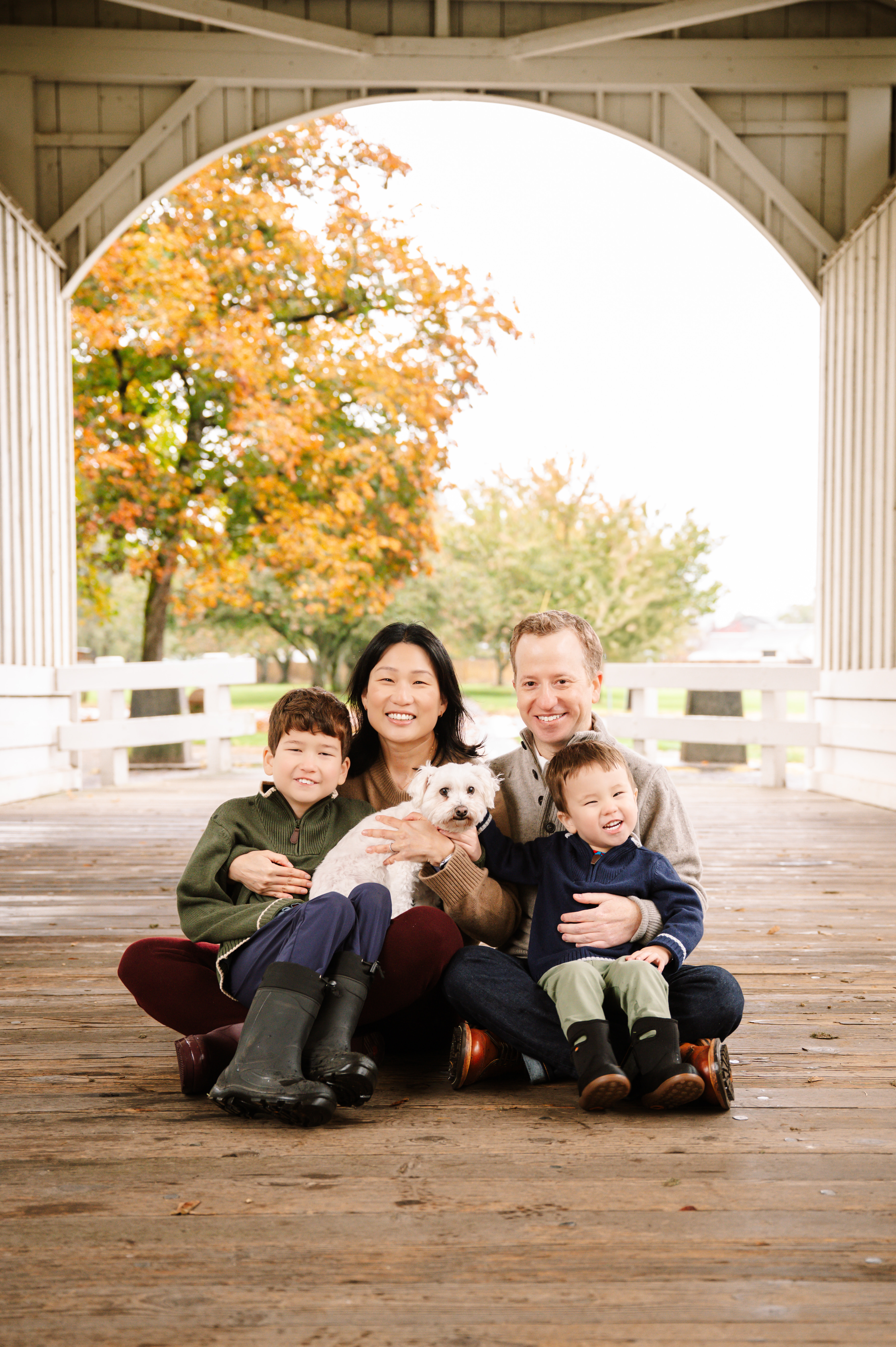 MattEgalkaMDposeswithhisfamilyonacoveredbridge