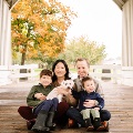 MattEgalkaMDposeswithhisfamilyonacoveredbridge