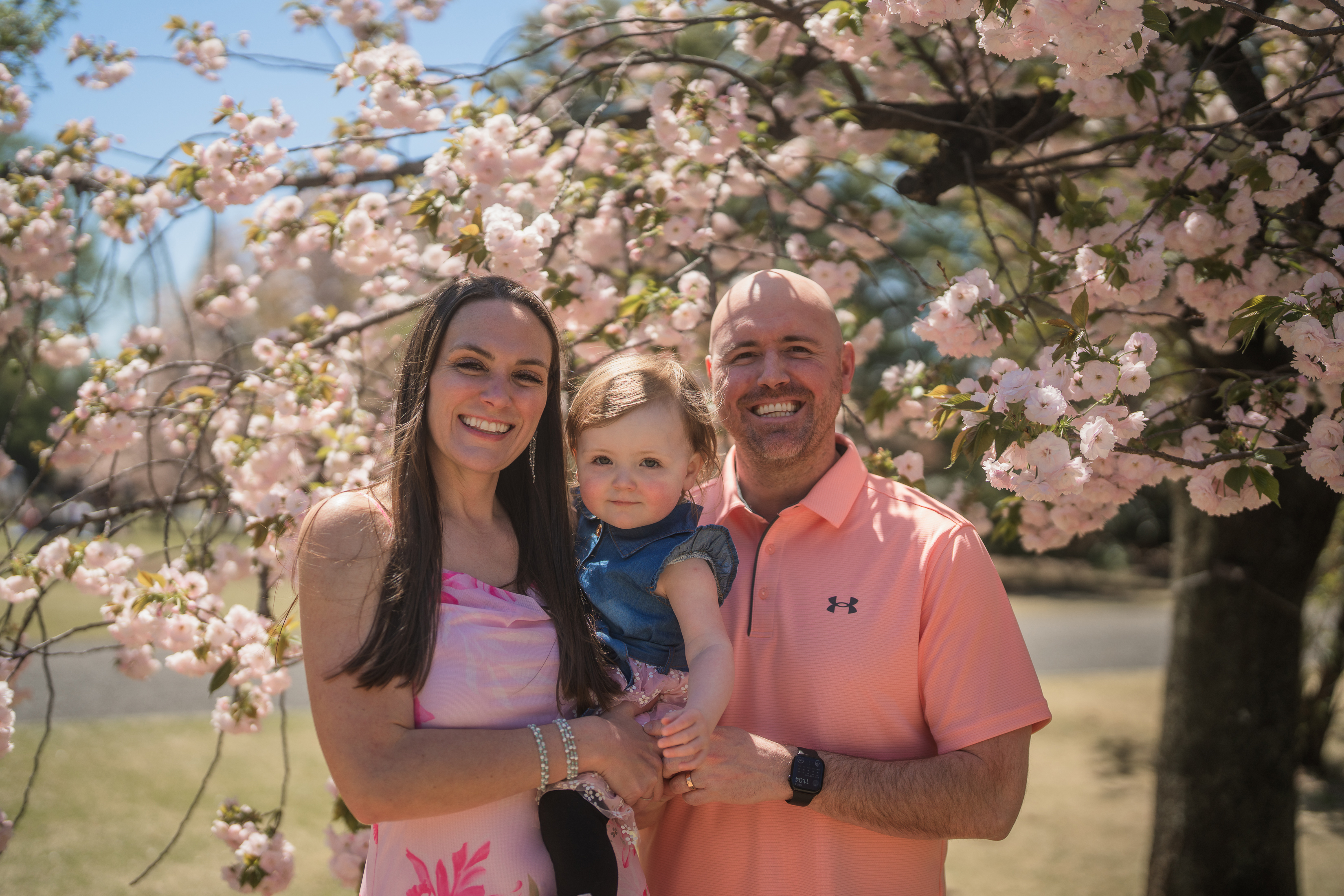 DrMeierwithherhusbandandtoddlerbeneathablossomingtree