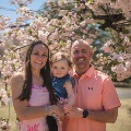 DrMeierwithherhusbandandtoddlerbeneathablossomingtree