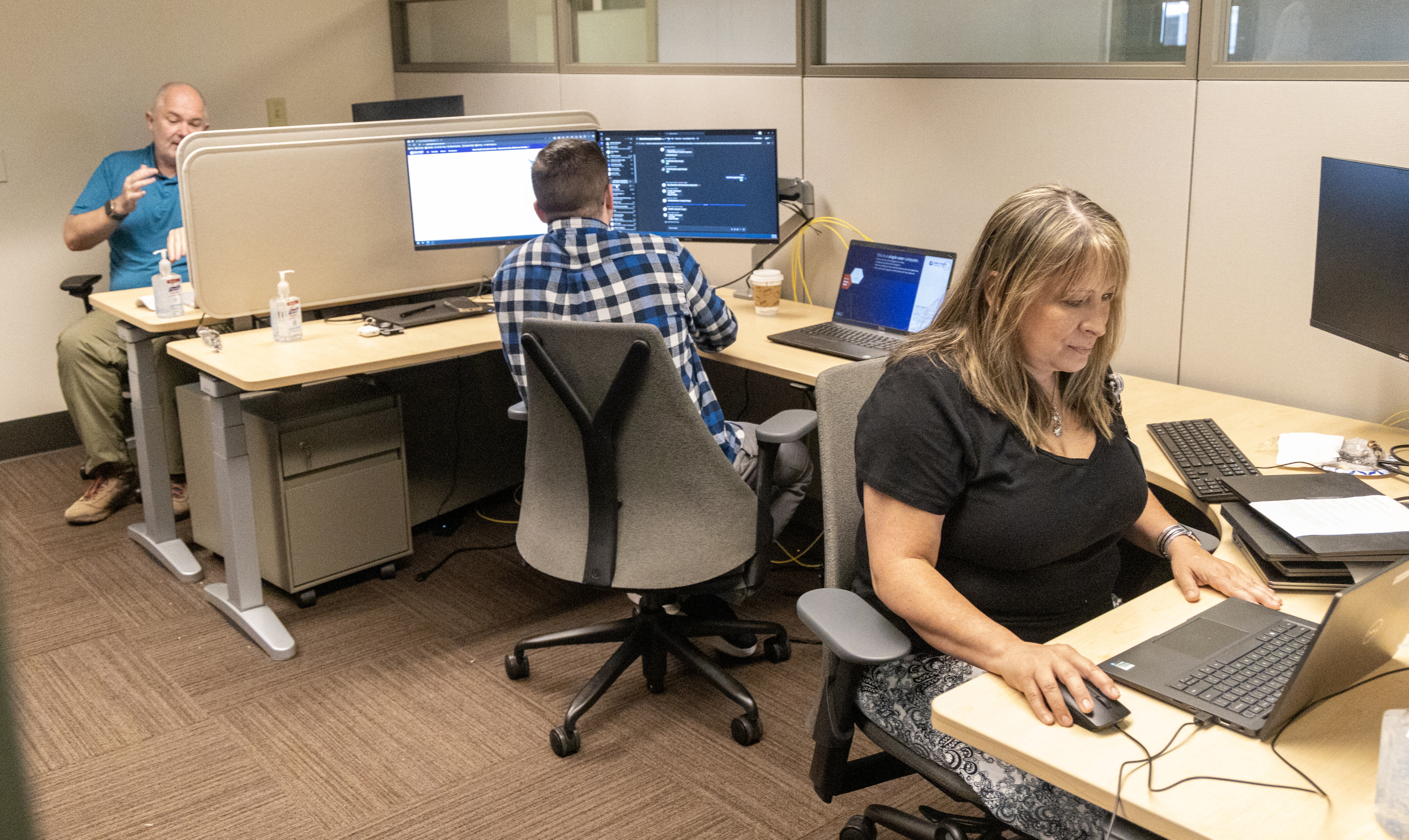 IS Infrastructure team members Doug Bruce, Patrick Wharton and Addy Null reboot some of the more than 7,000 systems affected by the global IT CrowdStrike disruption.