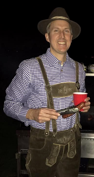 EricLaroMDdressedforOktoberfestholdingabratwurst