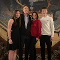 EricLaroMDwithhisfamilyinaformalsetting