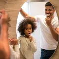 Fatheranddaughterbrushteethtogether
