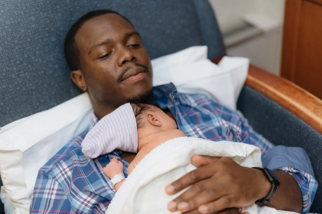 Dad having skin-to-skin time with baby
