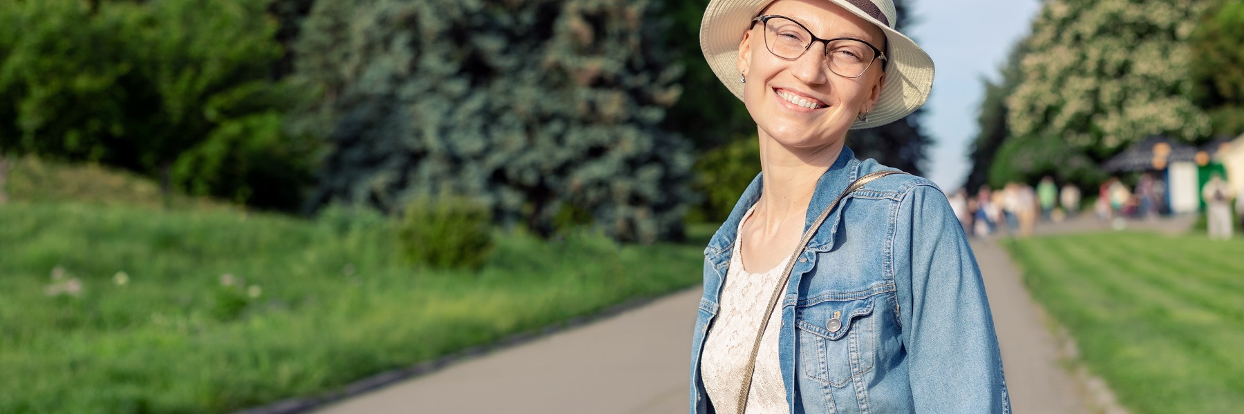 Womaninhatandcasualclothesenjoyinglifeaftersurvivingbreastcancer