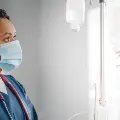 AnAfricanAmericanfemalenursefillsanIVbag