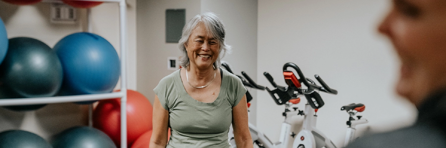 AsmilingwomantakespartinaCHECfitnessclass