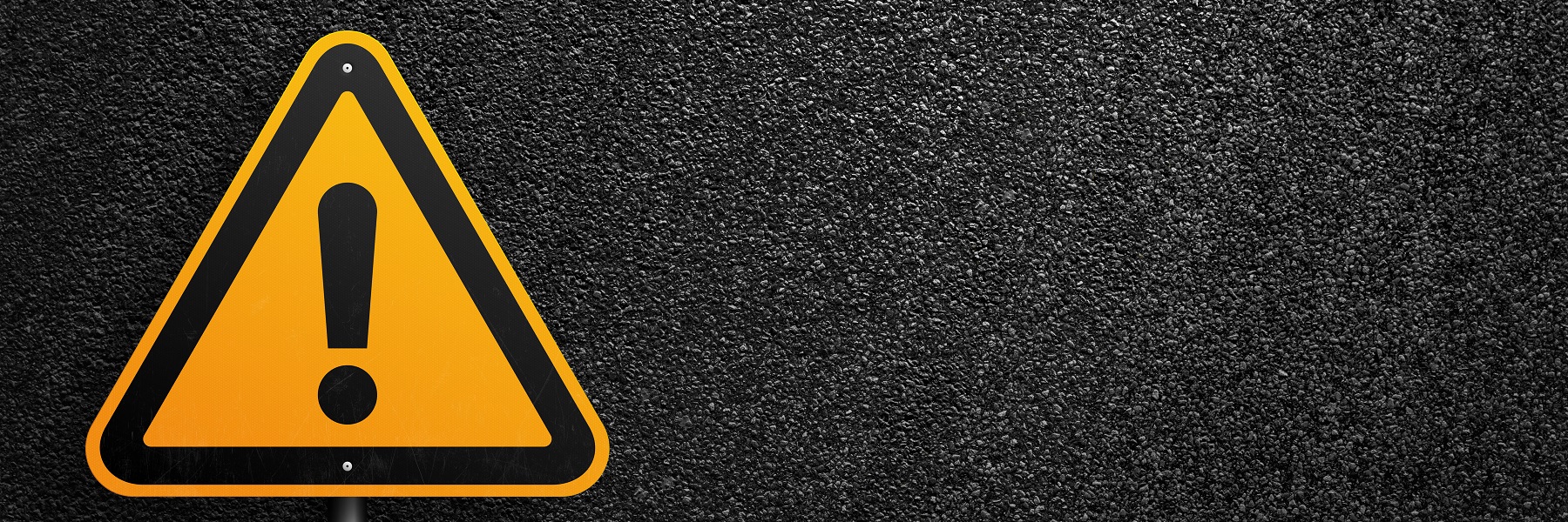 Animageofayellowsignwithanexclamationmarkonablackbackground