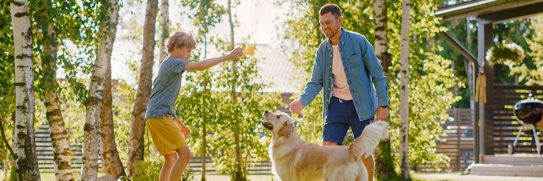 Familyplayingoutsidewithdog