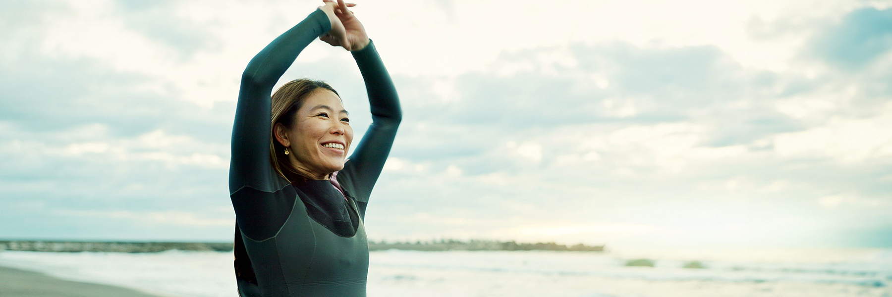 Womanstretchingonbeach