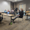 Behind the scenes at the Virtual Town Hall with ASL interpreters and moderator on April 21.