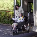 Patientinwheelchairusingalifttogetontoashuttlebus