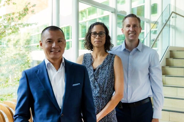 Three cancer doctors standing in the lobby