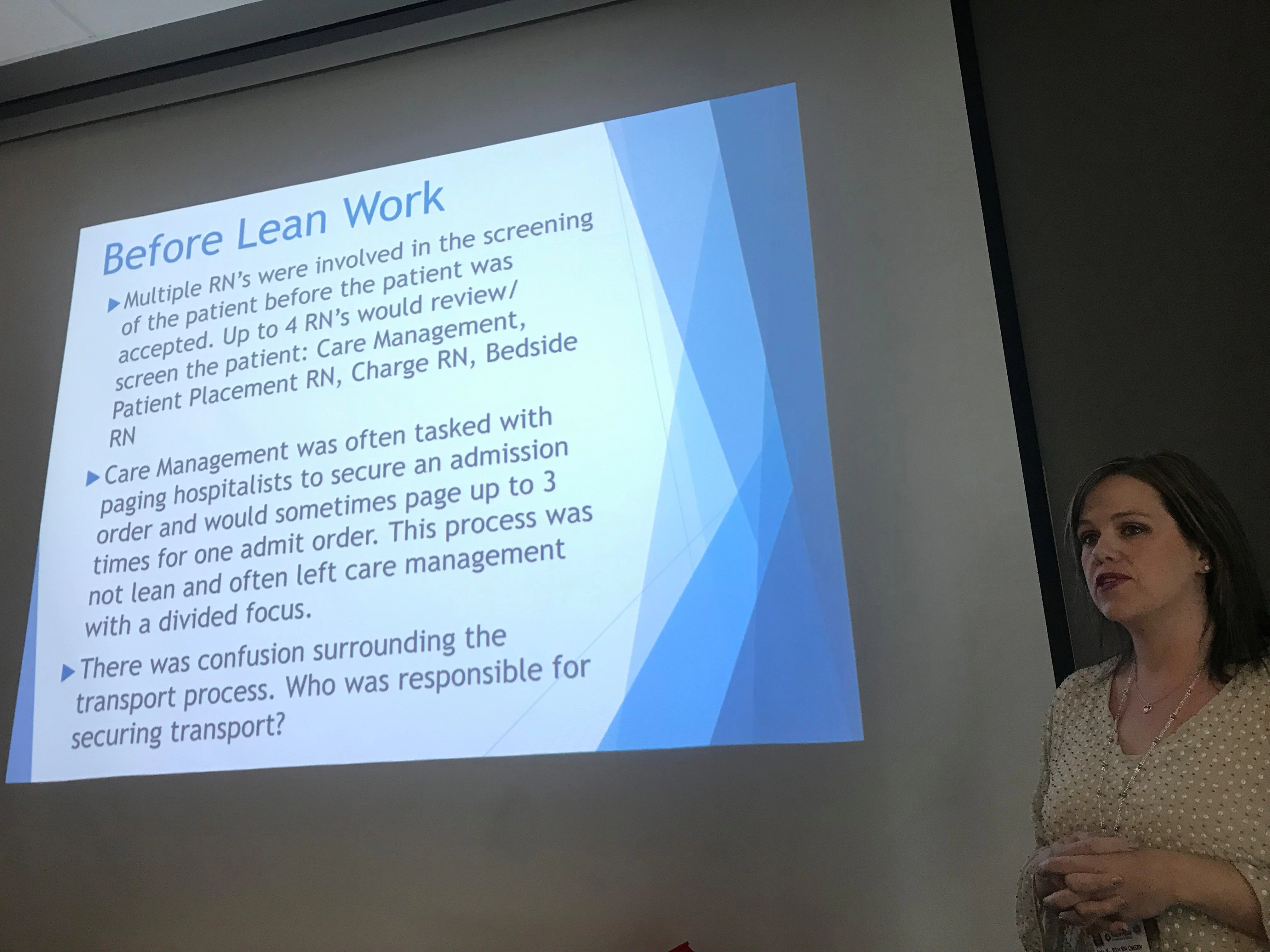 awomanbyascreendisplayinganEDthroughputPowerPointslide