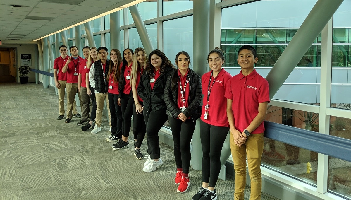 ASalemHealthvolunteersittingatadesk