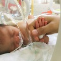 NICUbabyholdinghands