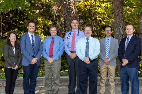 Cardiologyclinicprovidersstandingoutsidesmiling