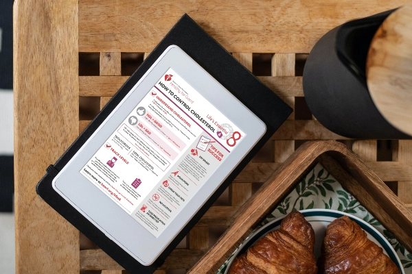 Tablet displaying a document on how to manage cholesterol