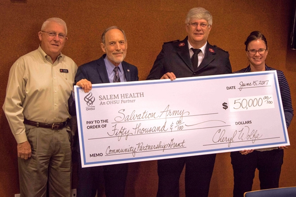 Herb Sims, Salvation Army Advisory Board Chairperson; Dr. Ralph Yates, Chief Medical Officer of Salem Health; Melissa Baurer, Salvation Army Director of Community Services; and Captain Dan Williams, Salvation Army Marion and Polk County Coordinator