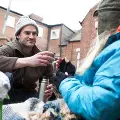 man-offering-hot-drink-from-flask-to-homeless-man_web_1600x1067_color