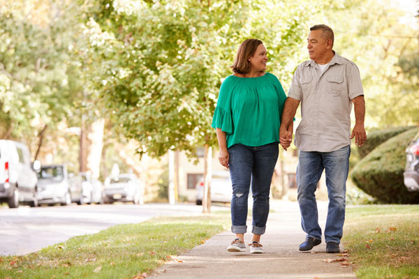 Couple walking on sidewalk