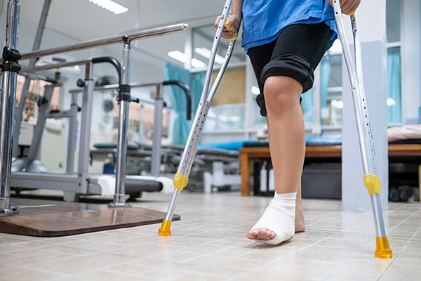 Man on crutches with foot injury