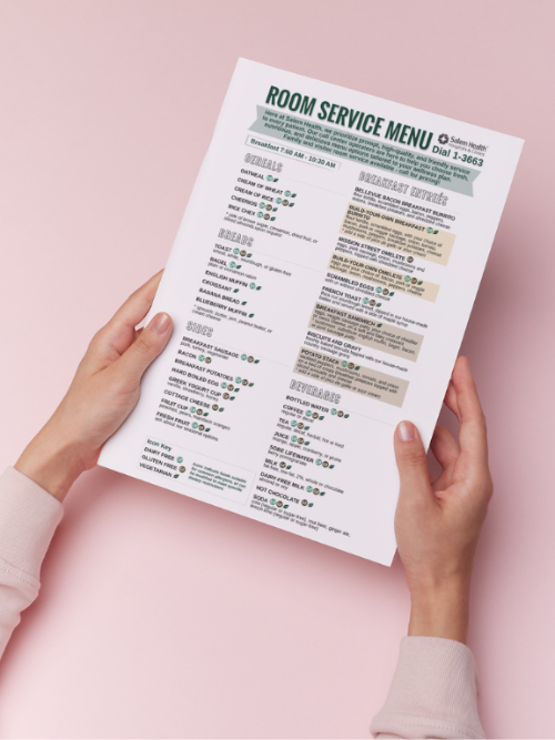 Photoofwomanholdingaroomservicemenu