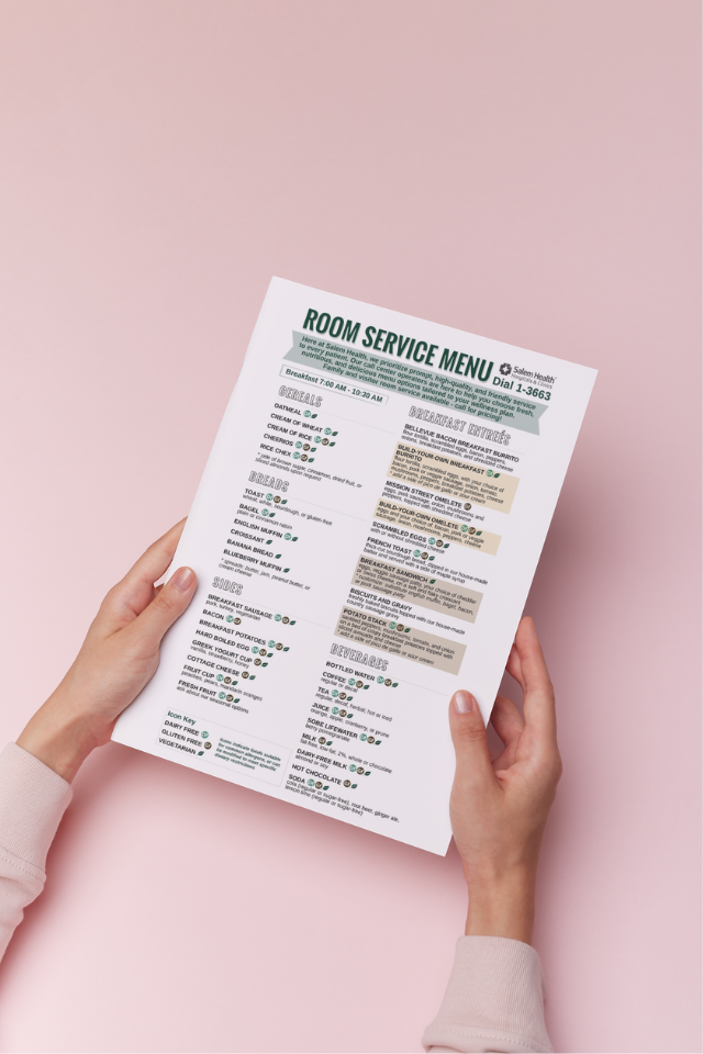 Photoofawomanholdingaroomservicemenu