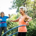 Joyfulolderwomenplayingwithhula-hoops