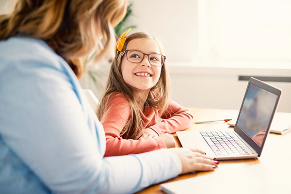 Mother and daughter on a laptop.