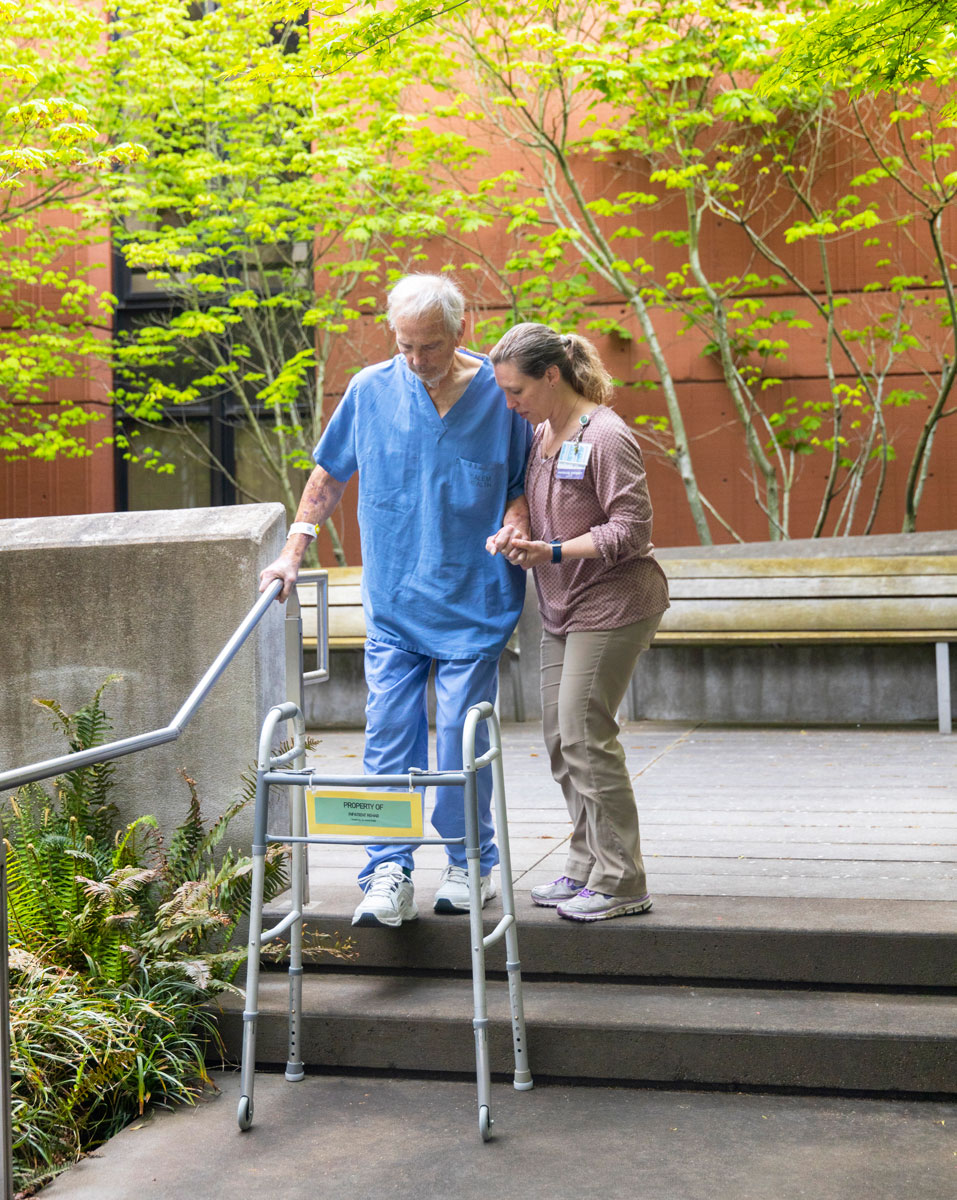 Assistingapatientinthecourtyard