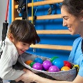 Childworkingwithacaringrehabtherapist