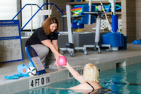 Patient exercising in pool