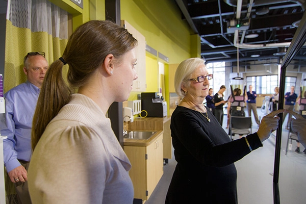 Patient using a touchscreen in rehabilitation
