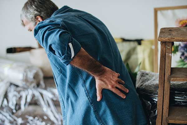 Manexperiencingbackpain