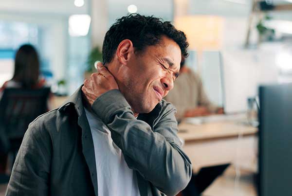 Manexperiencingneckpain