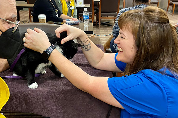 Happy-nurse-cat-therapy-Junior Junior lifts a nurses spirits