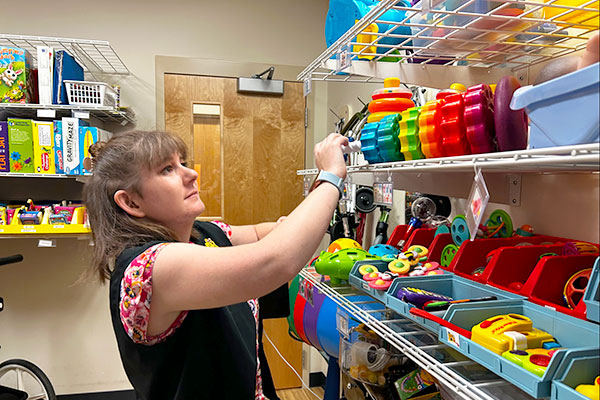 Volunteer organizing rehab supplies