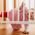 Babypeekingthroughbabysafetygate