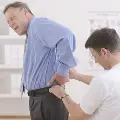 Doctorexaminesoldermanwithbackpain
