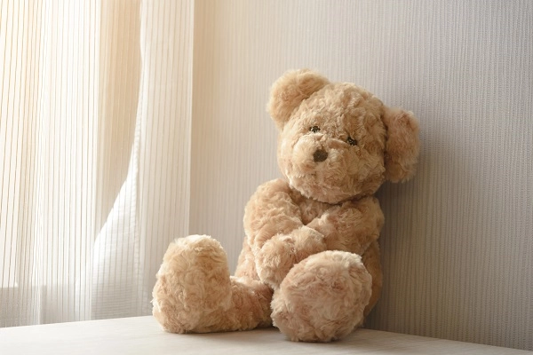 birth-testimonial-heather Teddy bear in the sunlight of a nursery
