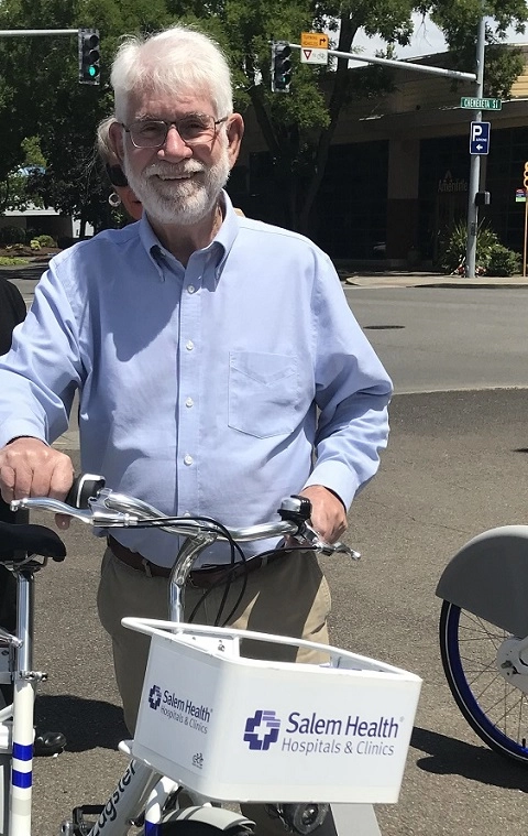 Salem Mayor Chuck Bennett with a bike share box.