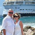 DebGoehringandpartnerinfrontofcruiseshipoceanscene
