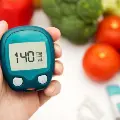 diabetesA1cmeterwithveggiesinthebackground