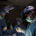 Surgeonsworkinadarkenedoperatingroom