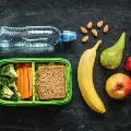 healthylunchboxwithfruitvegetablesandwater