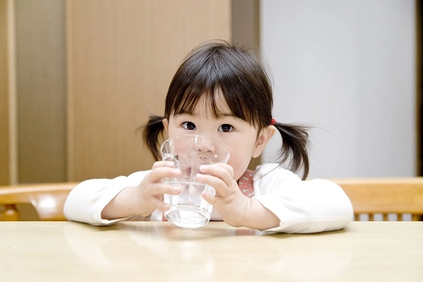 little girl with water