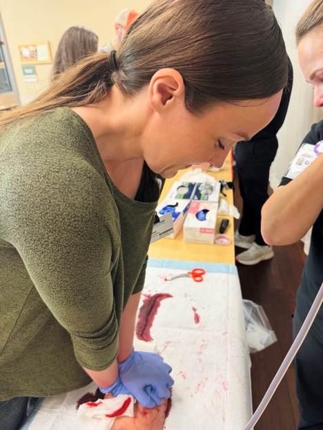 SHHC-2570_photo_Stop the Bleed first person_5 Applying pressure to a dummy wound